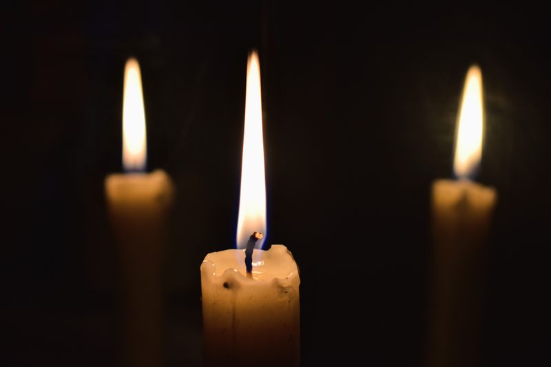 Candle-lit atmosphere representing the thoughtful, reflective spirit of Šepot